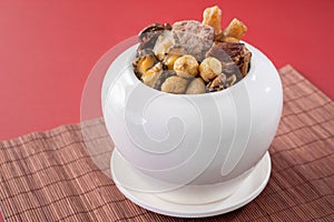 Traditional food of Chinese lunar new year, Buddha jumps over the wall, Chinese Soup Casserole dish, named Fo Tiao Qiang