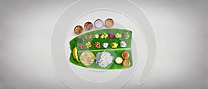 Traditional food Onam Sadya served on a banana leaf on Festival day onam,  Vegetarian meal with rice and curries, kerala food, Ker