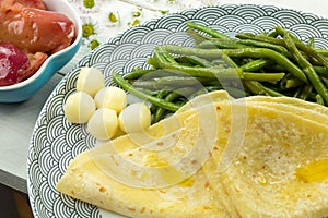 Salty pancake with green beans and cheese