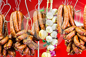 Traditional food. Smoked sausages meat hanging in european food