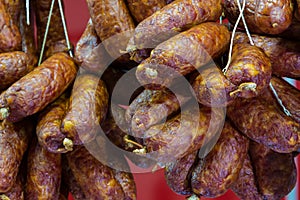 Traditional food. Smoked sausages meat hanging in european food