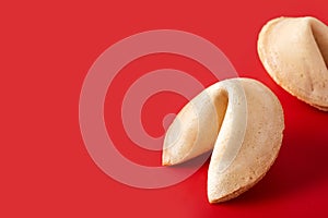 Traditional fortune cookie on red background