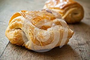 Traditional french chocolatine on wooden background