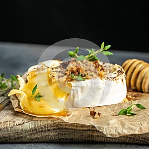 Traditional French homemade baked Camembert cheese with thyme