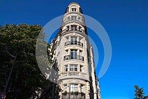 Traditional French house with typical balconies and windows. Paris.