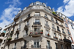 Traditional French house with typical balconies and windows. Paris