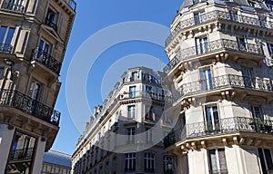 Traditional French houses with typical balconies and windows. Paris.