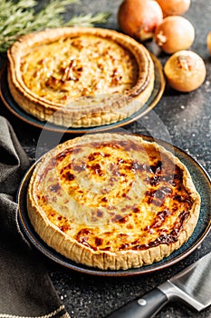 Traditional french pie. Quiche lorraine on kitchen table