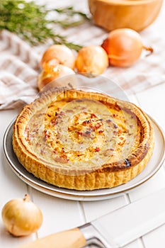 Traditional french pie. Quiche lorraine on white table