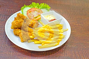 Traditional French potato fries with tomato salad ketchup and ma