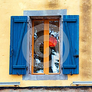 Traditional French window with shutters, Agde, France. Close-up.
