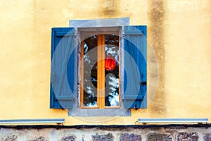 Traditional French window with shutters, Agde, France. Copy space for text.