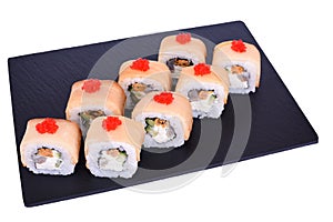 Traditional fresh japanese sushi rolls on a black stone Mikado on a white background. Roll ingredients: mussels, escolar fish,
