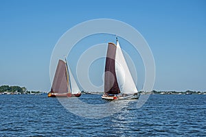 Traditional Frisian wooden sailing ships in a yearly competition in the Netherlands