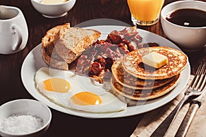 traditional full american breakfast eggs pancakes with bacon and toast