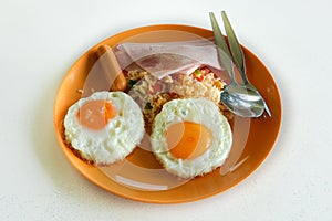 Traditional full English breakfast with fried eggs, sausages and bacon