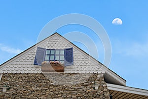 Traditional gable house with moon sky