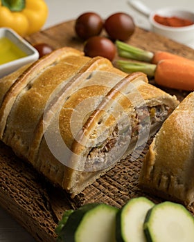 Traditional Galician empanada filled with vegetables and anchovies. photo