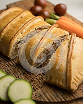 Traditional Galician empanada filled with vegetables and anchovies. photo