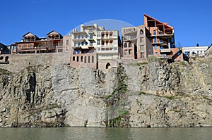 Traditional georgian architecture - beautiful buildings on the steep shore over the Kura River in Metekhi district. Tbilisi