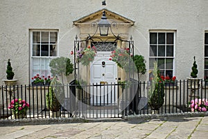 Traditional georgian property with hanging baskets and plants