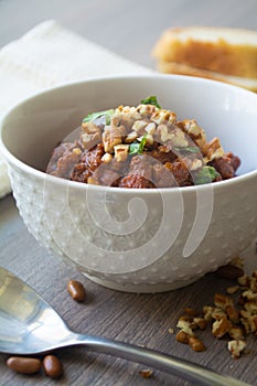 Traditional Georgian vegan kidney beam stew lobio with chopped walnuts and parsley 