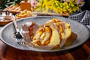 Traditional German braised pork cheeks in brown sauce