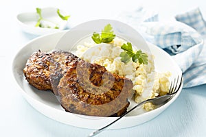 Traditional German burgers with potato salad