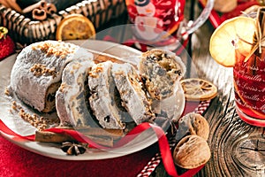Traditional German Christmas cake - Cranberry Stollen, Christmas tree, ornaments, and candles
