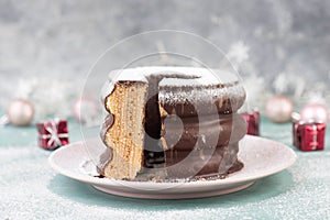 Traditional german christmas chocolate cake called Baumkuchen, winter season sweets