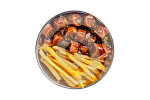 Traditional German currywurst sausage, served with chips or French fries in a pan. Isolated on white background.