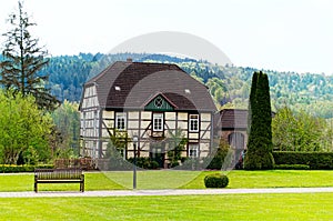 A traditional German fachwerk house in a garden