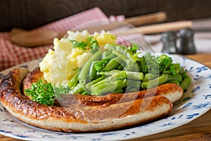 German Bratwurst with mashed potatoes and vegetables