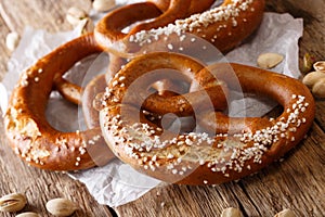 Traditional German salted pretzel bread macro on the table. Hori