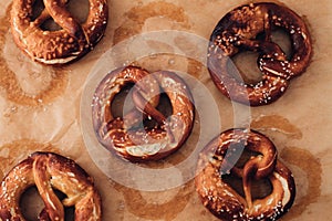 Traditional German Savory Lye Pretzel with Salt on Piece of Parchment Paper.