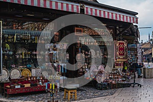 November 14 2022: Traditional gift shops in historical center of Sarajevo, Bascarsija. Shopping bosnian souvenirs