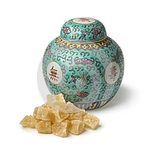 Traditional ginger jar with a heap of candied ginger
