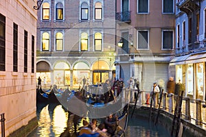 Traditional gondola ride at night in venice