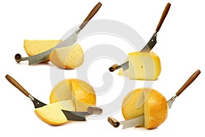 Traditional Gouda and Edam cheese pieces with a cheese cutter