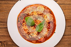 Traditional gourmet pasta flat lay. Overhead view of a plate of pasta with delicious sauce. Italian food concept.