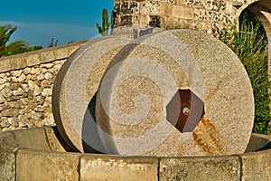 Traditional granite mill for pressing olives. Typical Salento farmhouse, Puglia Italy.