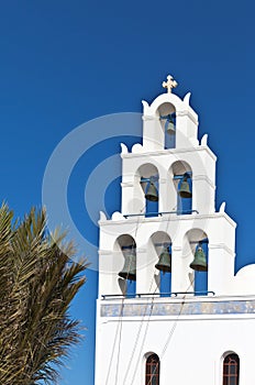 Traditional Greek arched white bell tower, Santorini, Oia, Greece