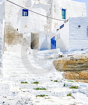 Traditional greek architecture, Stairs,  whitewashed walls and blue doors at Kastro village