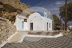 Traditional Greek chapel on the hill. A small Greek church by the sea.