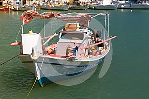 Traditional greek fishing boat on the port