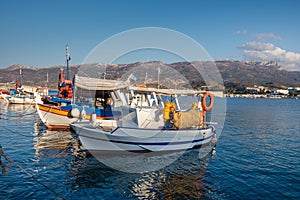 Traditional Greek fishing boats at harbor of Sitia town on eastern part of Crete island, Greece