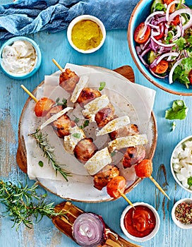 Traditional Greek Food, Souvlaki, Grilled Chicken, Vegetables, Tzatziki, Mediterranean Cuisine, Wooden Table, Overhead View.