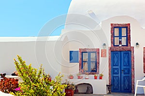 Traditional Greek house with blue door and windows, Santorini