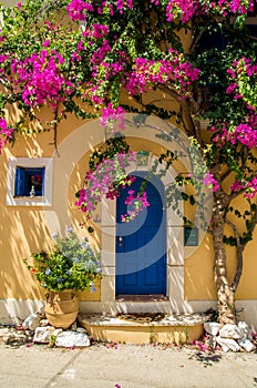 Traditional greek house with flowers in Assos, Kefalonia island,