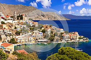 traditional greek island Symi with colorful houses and emerald sea. Dodecanese